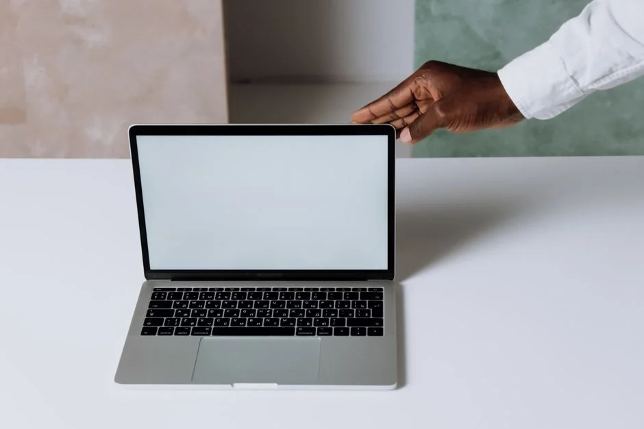 A polished office desk arrangement showcasing Apple devices: iMac, MacBook, and iPad.